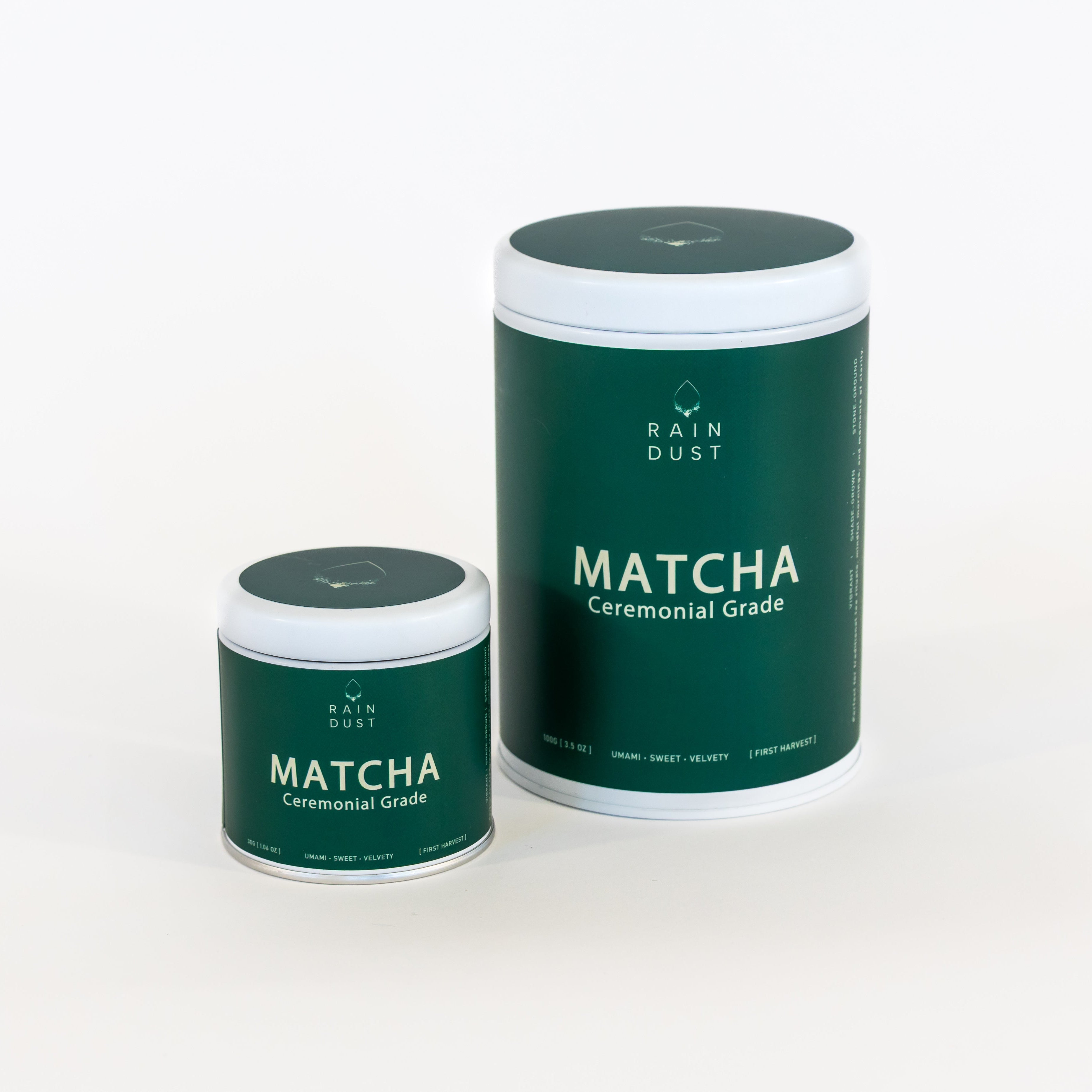 Two green matcha containers with 'Rain Dust' branding on a white background