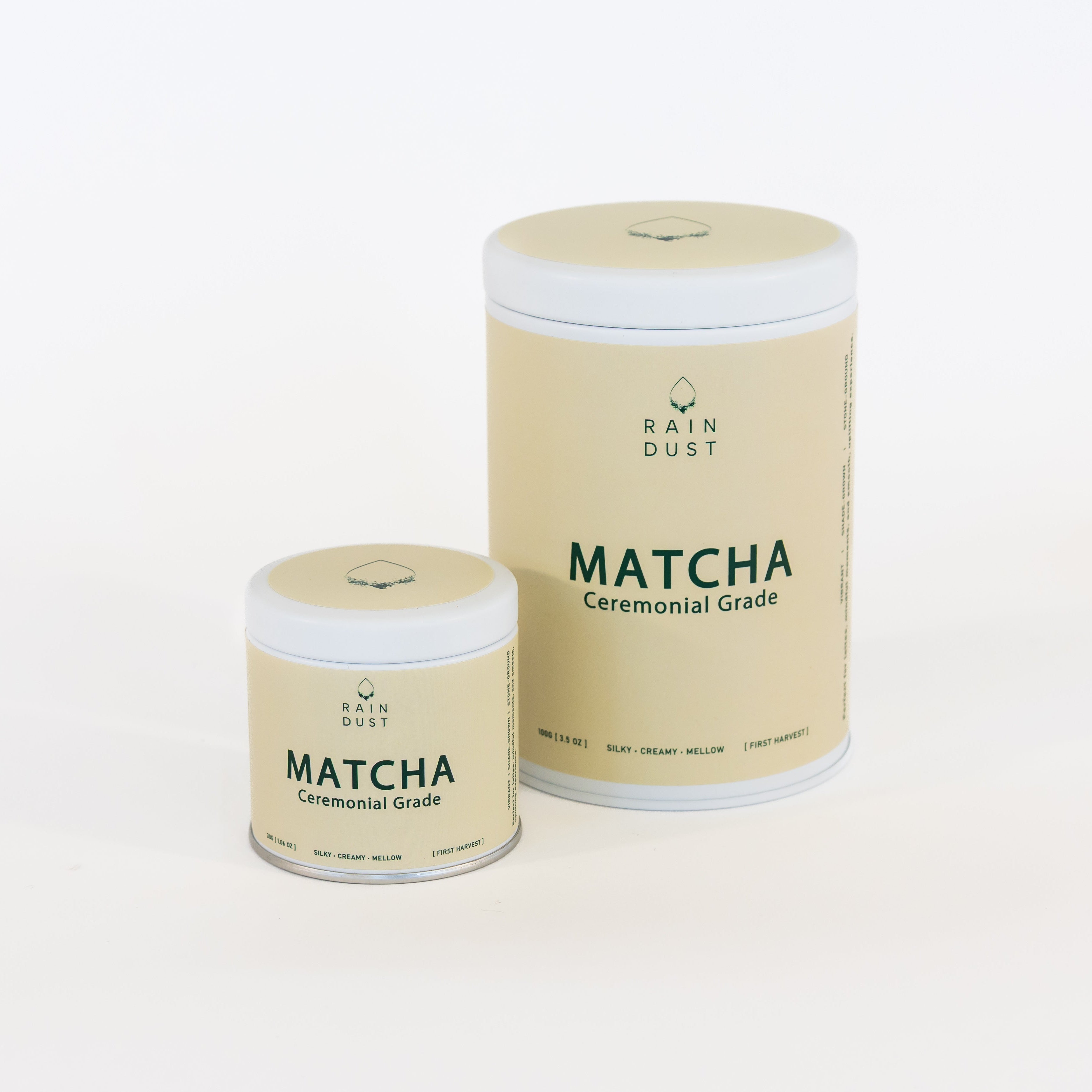 Two containers of Rain Dust Matcha Ceremonial Grade on a white background